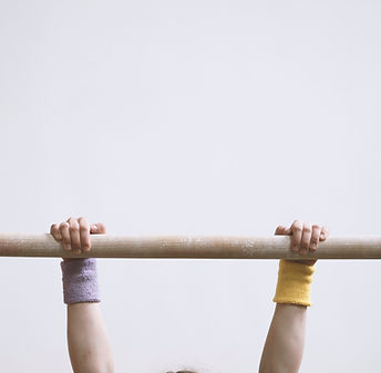Gymnast on a Wooden Bar
