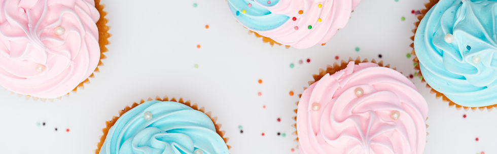 panoramic shot of colorful cupcakes with sprinkles.jpg