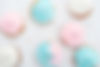 top view of delicious white, pink and blue cupcakes with sprinkles .jpg