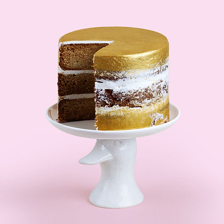 Gold and White Cake on a Stand