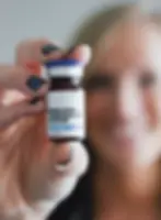 Semaglutide injection vial held by a provider for medically supervised weight loss treatment at Pura Vida Wellness