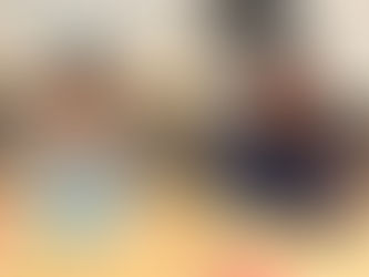 Child and mentor working on crafs together.