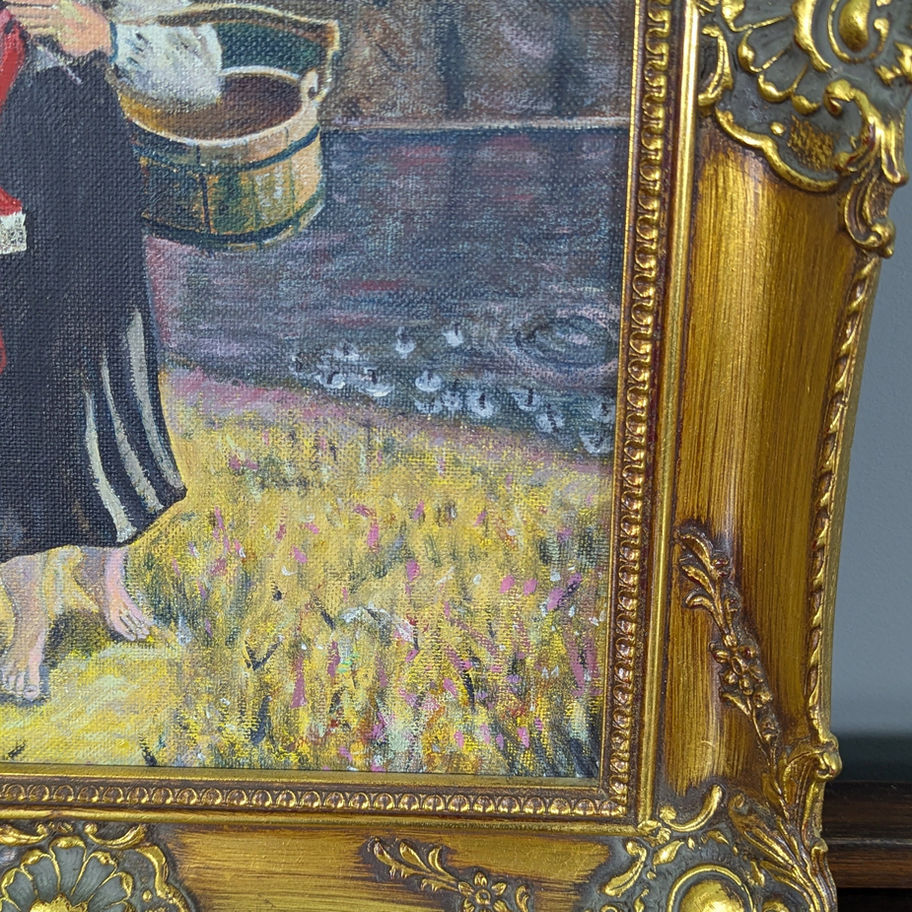 Moteris su skalbiniais, paveikslas auksiniame rėme