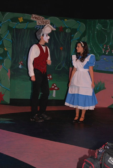 An actor dressed as the White Rabbit and an actress dressed as Alice in "Alice in Wonderland"