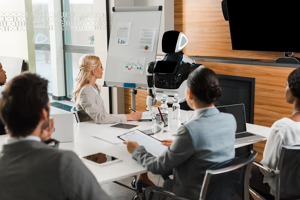 A group of corporate workers in a meeting looking at an AI-driven robot