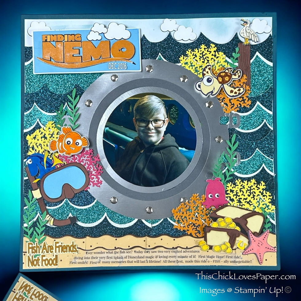 Scrapbook page featuring a child in a porthole, surrounded by "Finding Nemo" theme. Bright colors, ocean waves, and coral accents. Text: "Fish Are Friends, Not Food!"