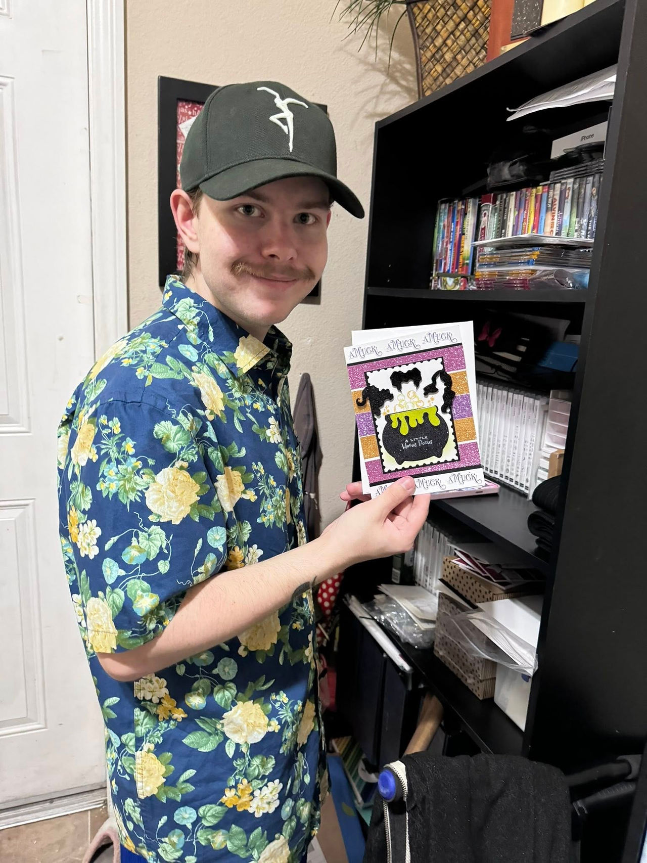 Little man showing the front of the card