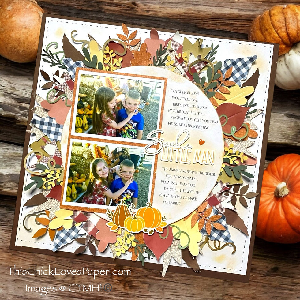 Scrapbook page with two photos of children at a pumpkin patch, surrounded by autumn leaves, patterns, and text saying "Smile Little Man."