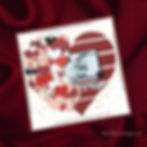 Scrapbook page with photo of two people, surrounded by red, pink heart patterns. Text reads "Grandma & Me." Set on a red fabric background.