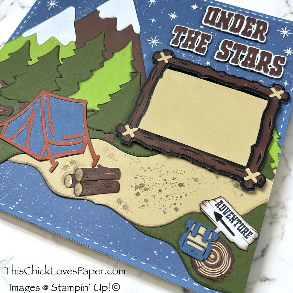 Scrapbook page with mountains, trees, tent, and logs. Stars in the blue sky. Text: "Under the Stars" and "Adventure." Outdoor theme.