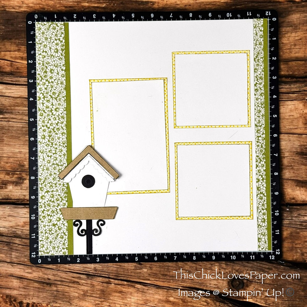 Scrapbook page with yellow photo frames, a decorative birdhouse, and floral borders on a wooden surface. Text: ThisChickLovesPaper.com.