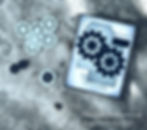 Gears in black and white paper on a textured surface, with a card featuring gear patterns and tags. Text: ThisChickLovesPaper.com.