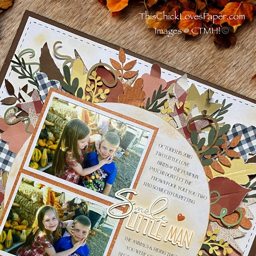 Scrapbook page with two children smiling in a pumpkin patch. Decorative fall leaves, plaid patterns, and text reading "Smile Little Man."