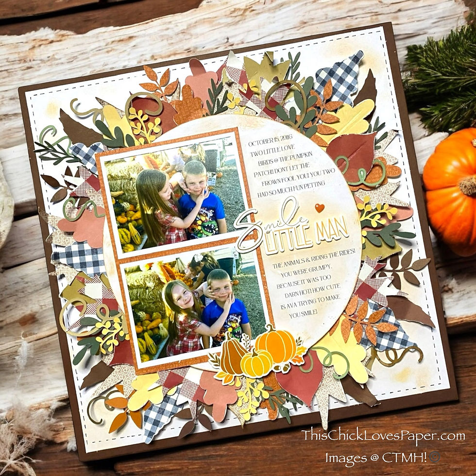 Scrapbook page with two photos of kids at a pumpkin patch. Colorful autumn leaves and pumpkins surround images. Text: "Smile Little Man".