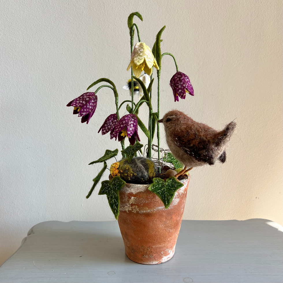 Thumbnail: Jenny wren and resting bee in fritillaries