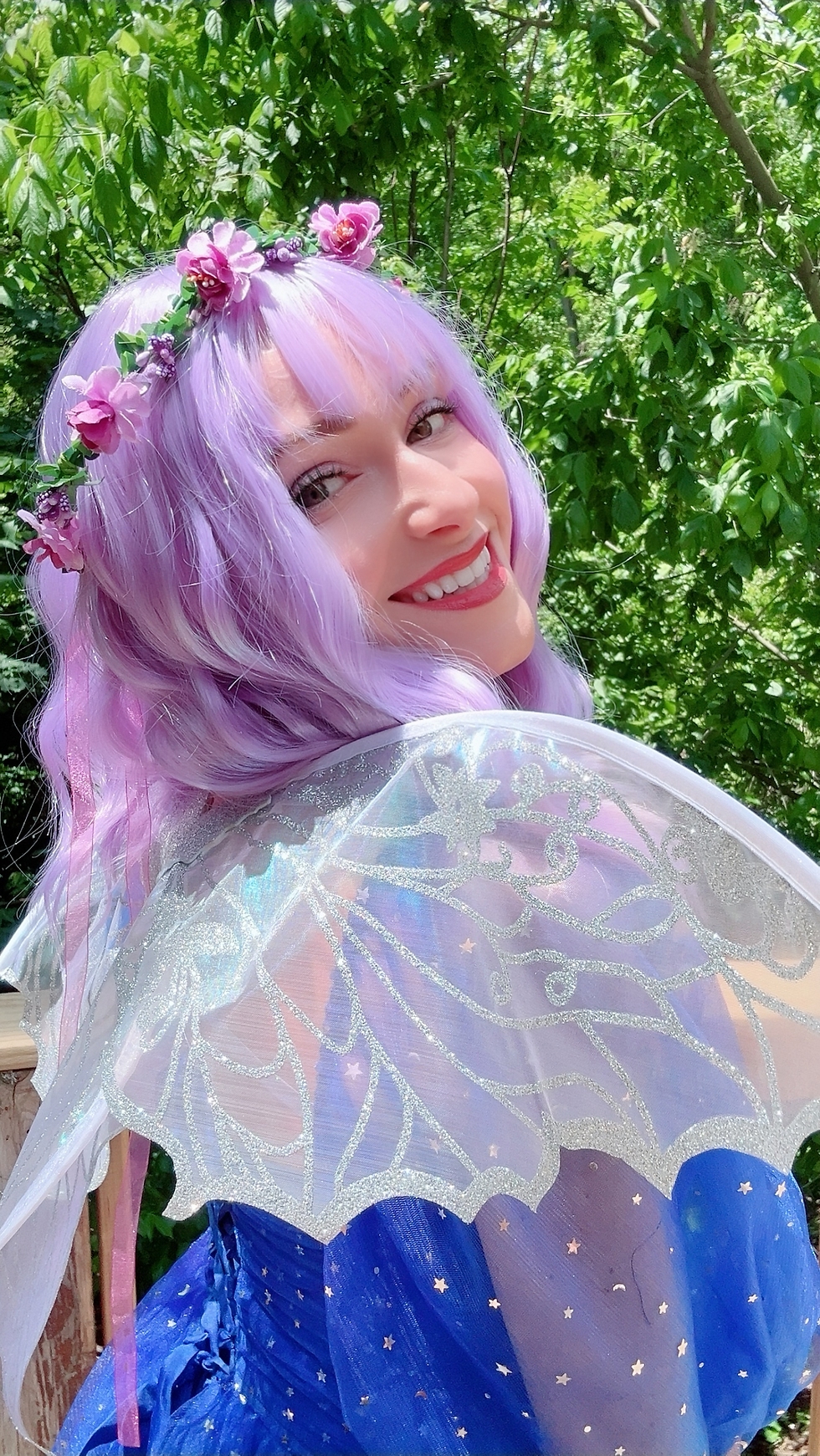 Whimsical fairy character Luna in a shimmering costume with purple wings, representing imaginative play and mindfulness