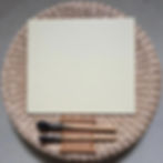 Shikishi board made of Torinoko paper on display with Japanese brushes