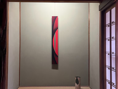 Traditional Japanese tokonoma alcove with contemporary vertical artwork and ceramic vessel at Art San Gallery
