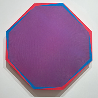 Geometric wall work by Japanese artist Tadasuke Jinno in purple, blue, and red on an irregular polygon-shaped canvas.