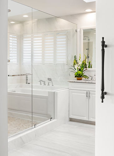 Remodeled master primary bath with wet room and porcelain slab walls