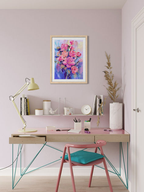 Colourful floral art print in wooden frame, hung in a home office featuring pale pink walls and a pink desk