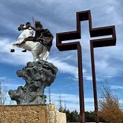 Jesus Christ riding a white horse and the cross at 'The Coming King sculpture Prayer Garden.'