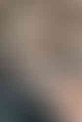 couple sitting on the front of a boat on their wedding day in the Amalfi coast