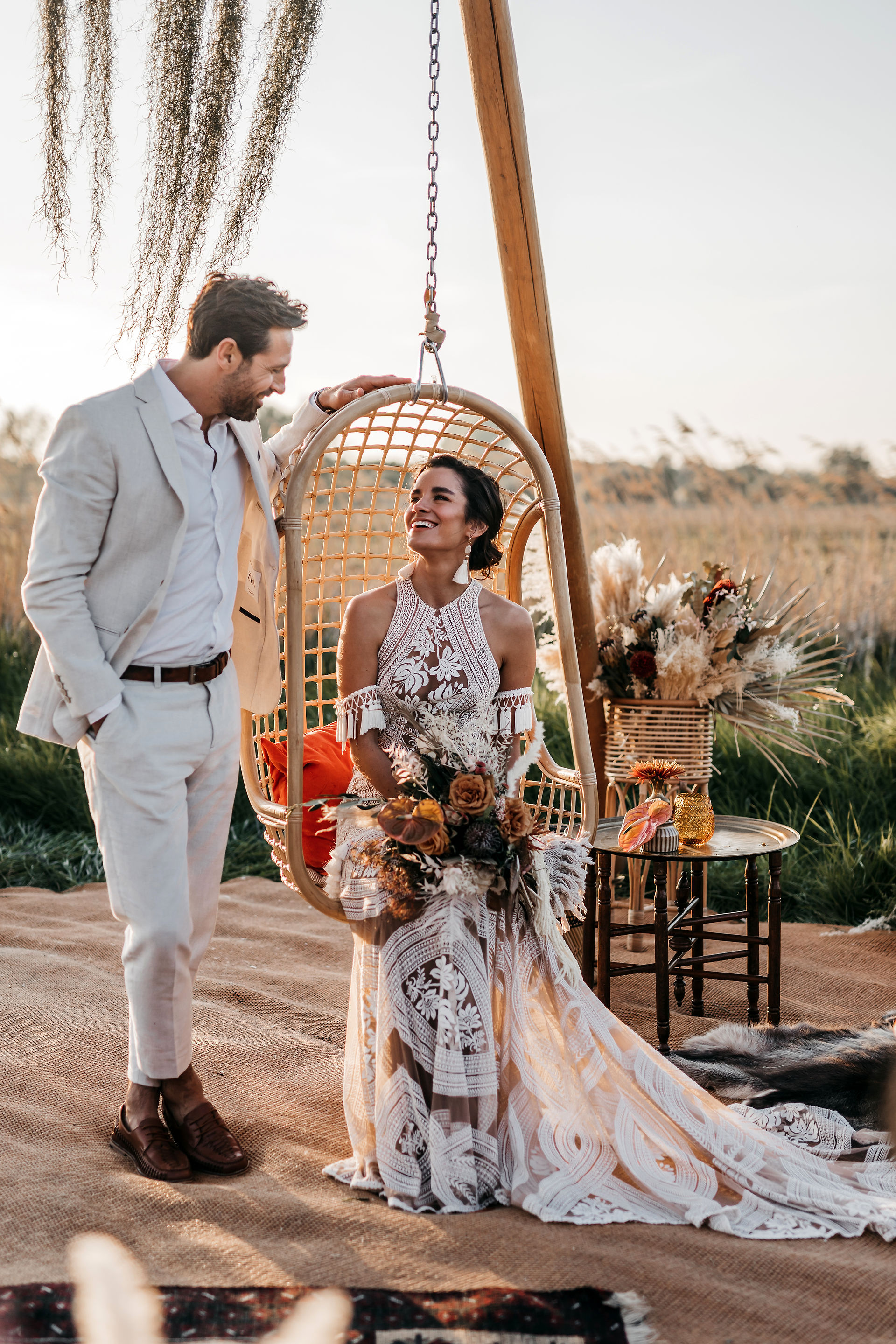 bride in Rue de seine dress and groom in white linen suit