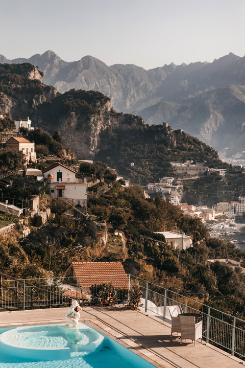Views of the houses on the mountain side and mountains around Amalfi