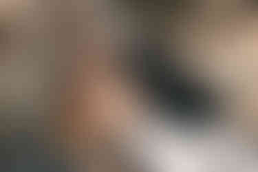 bride and groom kissing on a boat in Positano