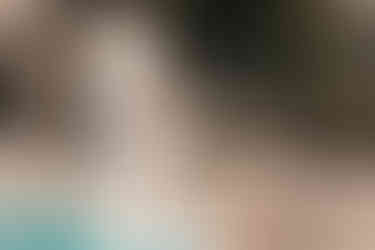 statue holding roses on the edge of the swimming pool on the terrace at Le Nereidi wedding venue