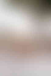 outdoor wedding reception table on the terrace of a Amalfi coast wedding venue. The table is decorated with pink and peach rose floral centrepieces.