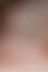 Bride and groom sitting together surrounded by large moroccan rugs at Beldi Country Club for their intimate destination elopement wedding day in Marrakesh