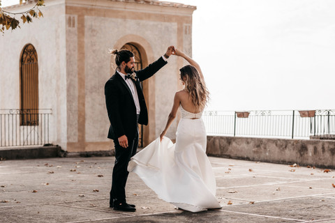 bride and groom dancing together on a terrace on the Amalfi coast