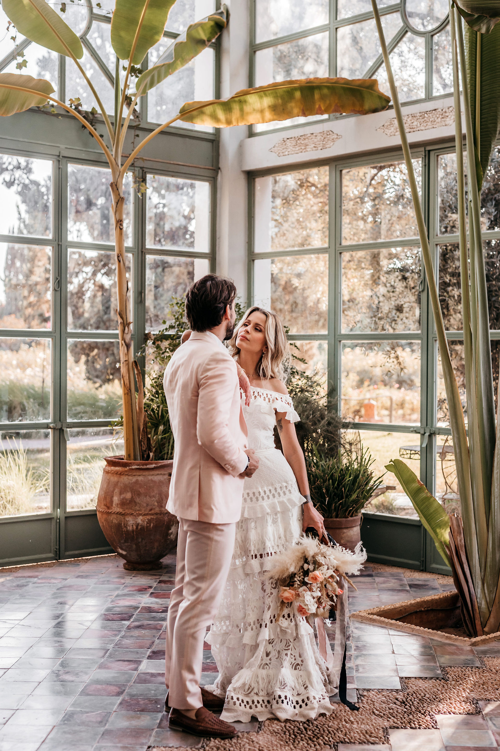 bride and groom standing in the greenhouse at Beldi Country Club in Marrakech