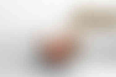 wedding bouquet with peachy pink roses, white dried flowers and olive greenery made by Sass Flower for this Amalfi coast elopement