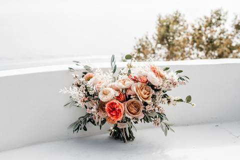 wedding bouquet with peachy pink roses, white dried flowers and olive greenery made by Sass Flower for this Amalfi coast elopement