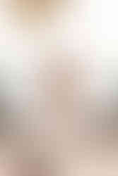 Bride holding a bouquet of roses on a terrace overlooking the sea on the Alma coast