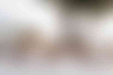 outdoor wedding reception table on the terrace of a Amalfi coast wedding venue. The table is decorated with pink and peach rose floral centrepieces.