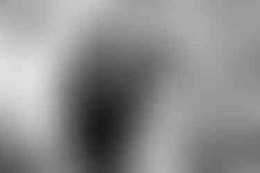 Bride and groom walking by a bell tower on a terrace on the Amalfi coast