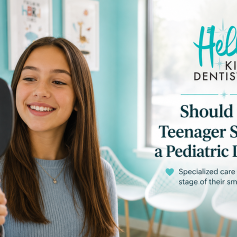 Smiling teenage girl looking at her healthy smile in a mirror during a visit to Hello Kids Dentistry in Bothell, WA.