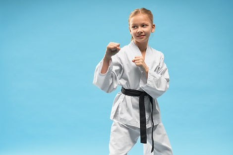 karate-girl-defense-position-practicing-combat-sports_7502-4337.jpg