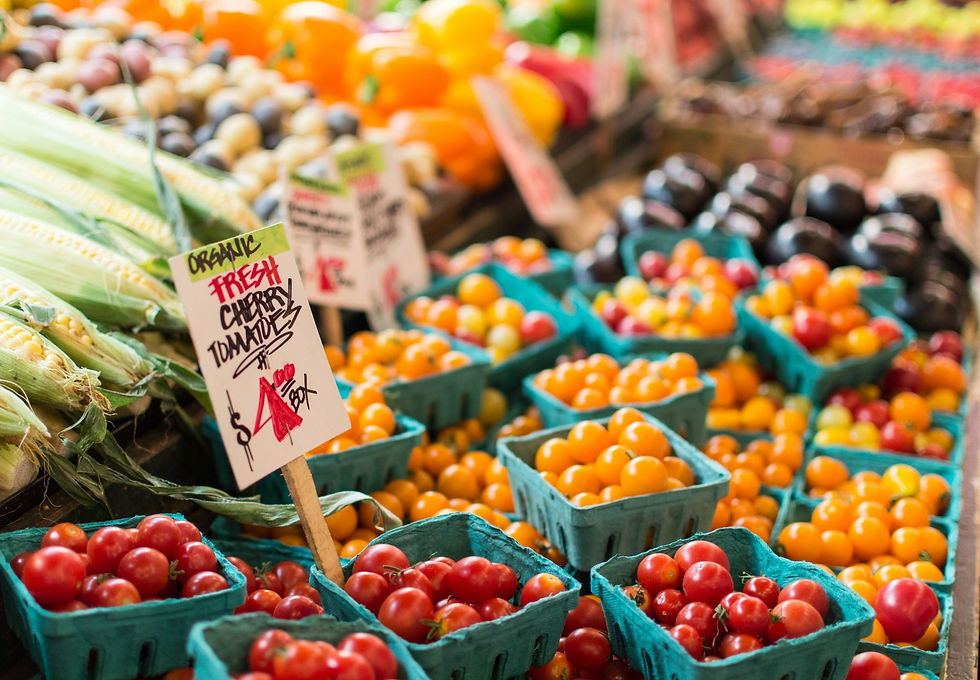 Baskets of fresh tomatoes at a farm market