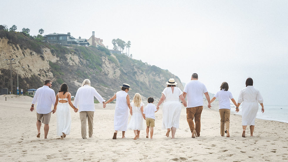 white and beige outfits for family photo session on the beach