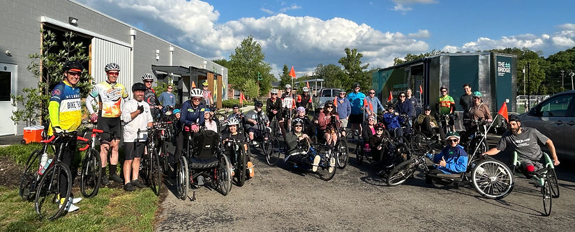 Group of handcyclists ready to begin a ride together.