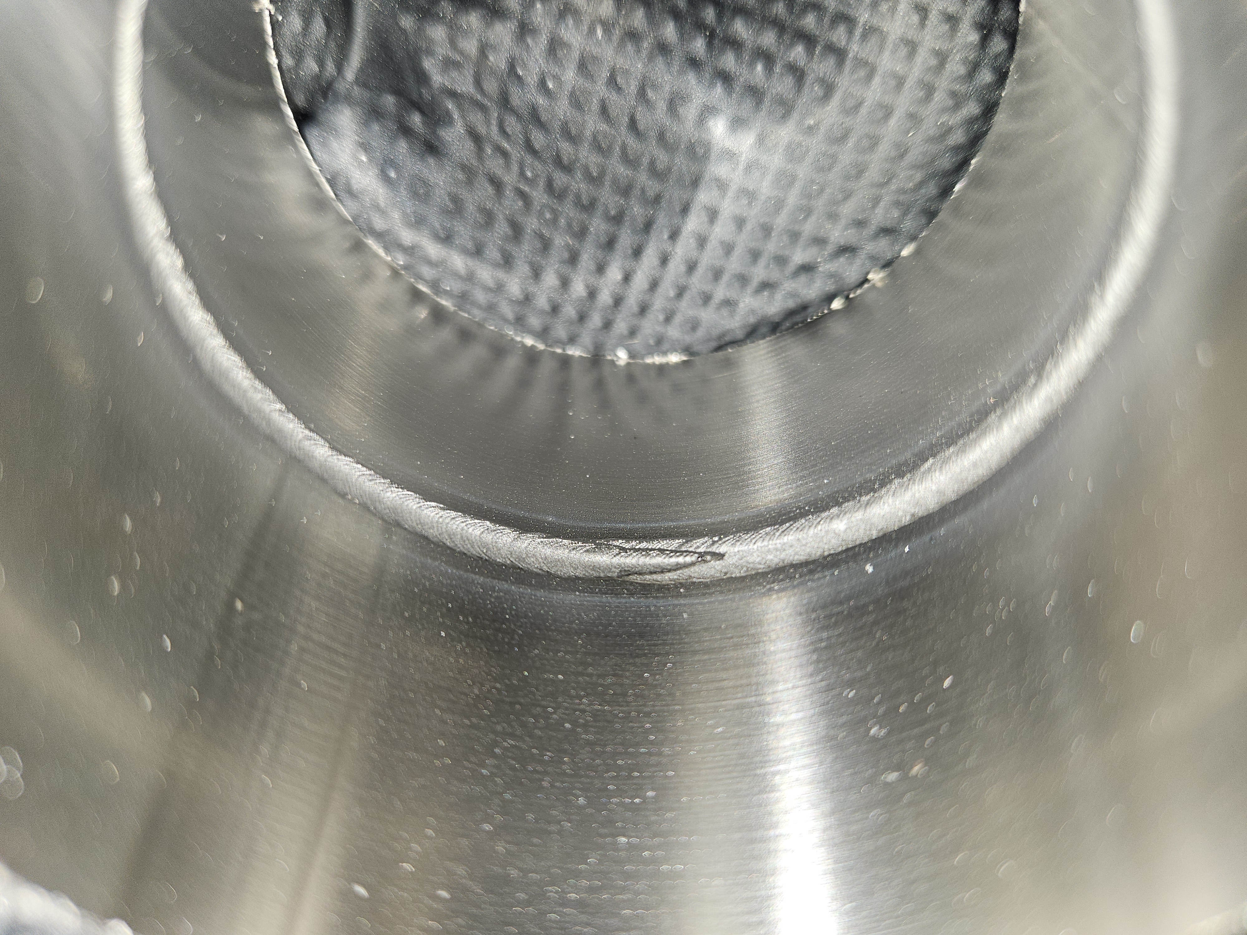 Close-up of a circumferential weld inside metal tubing