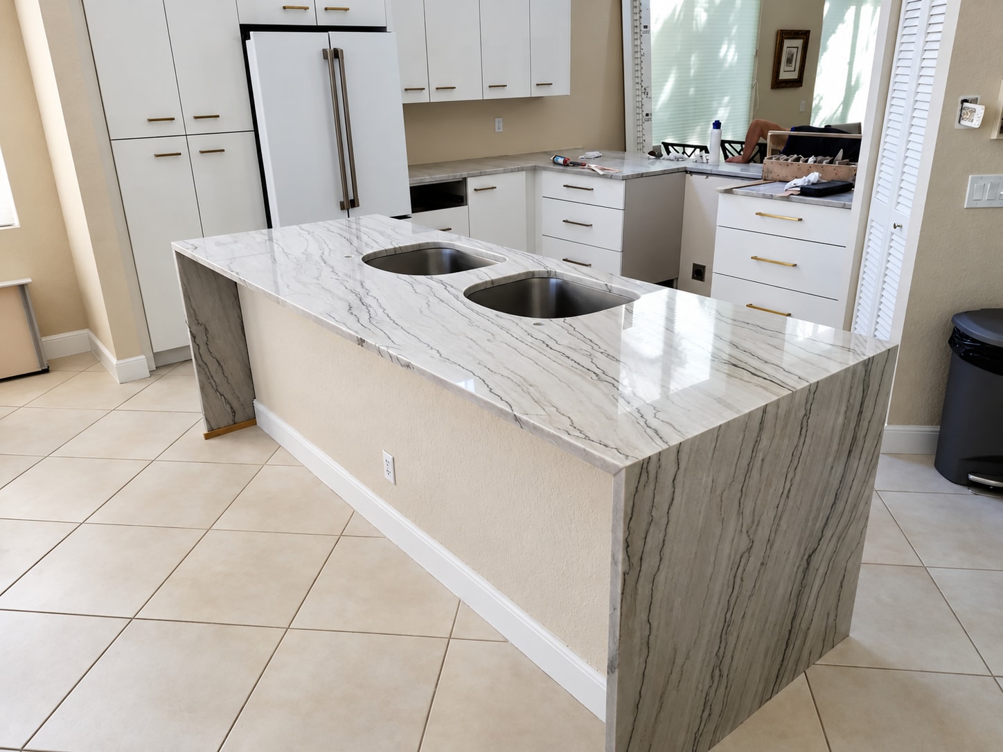 White kitchen & waterfall island