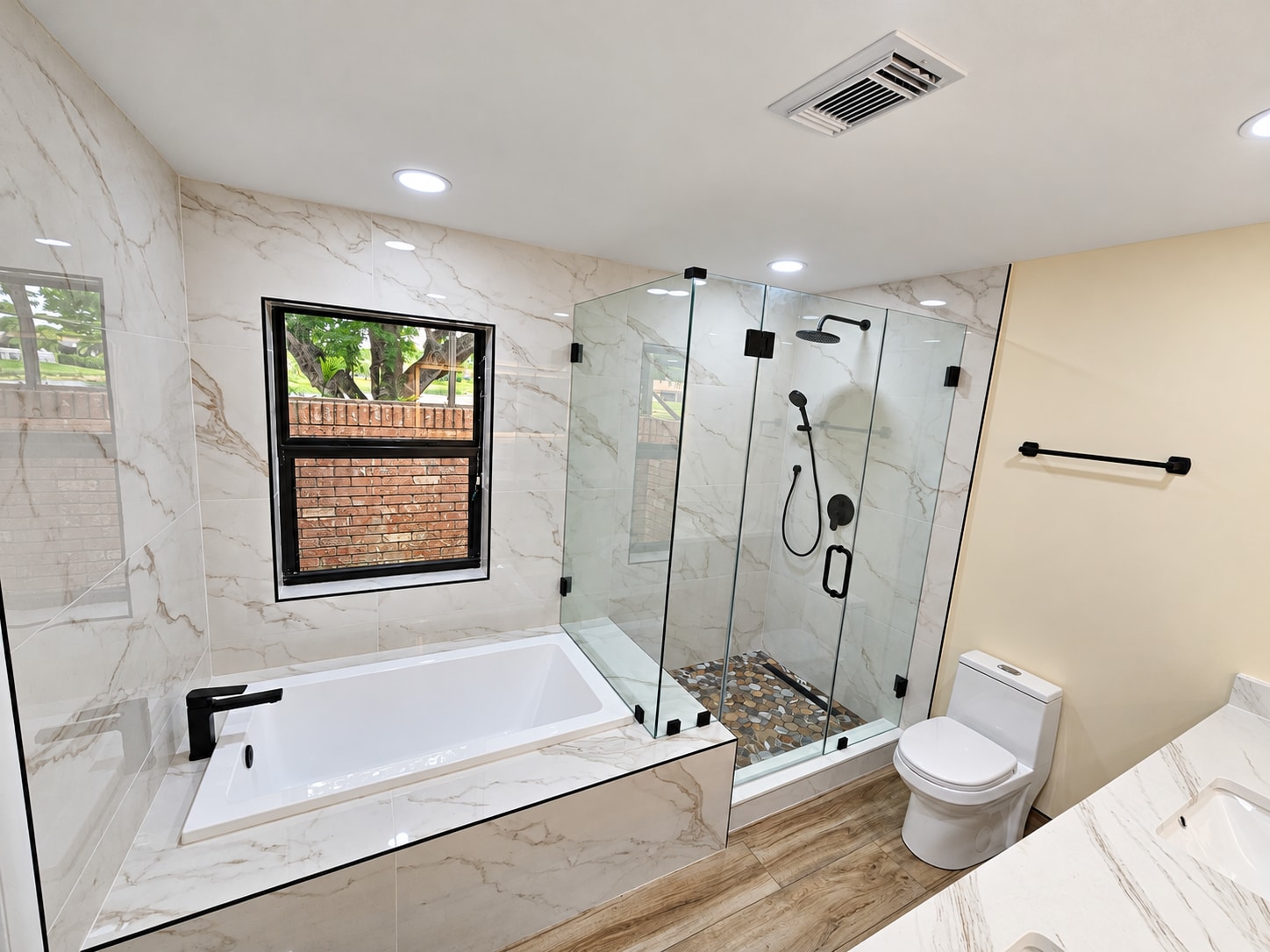 Tub, glass shower & double vanity