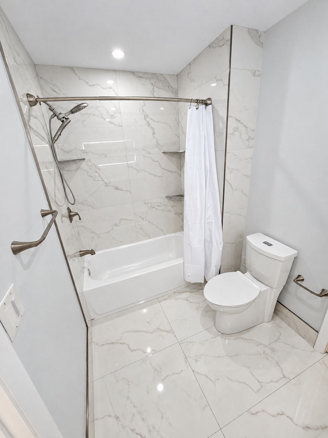 Gray vanity & marble tub bathroom — project view 2