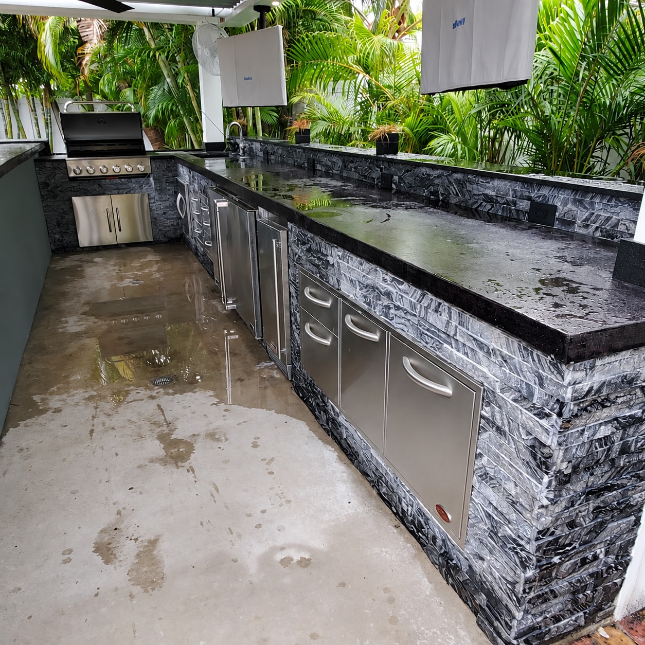 Covered outdoor kitchen & stone bar — project view 2